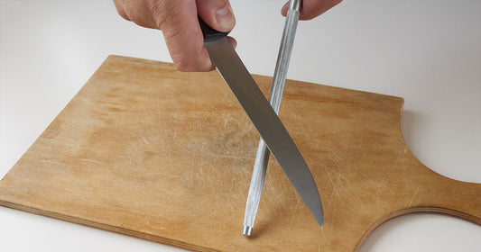 sharpening-knife-on-cutting-board