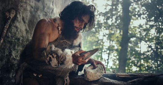 caveman-holding-sharp-stone