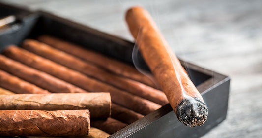 lit-cigar-on-cigar-box