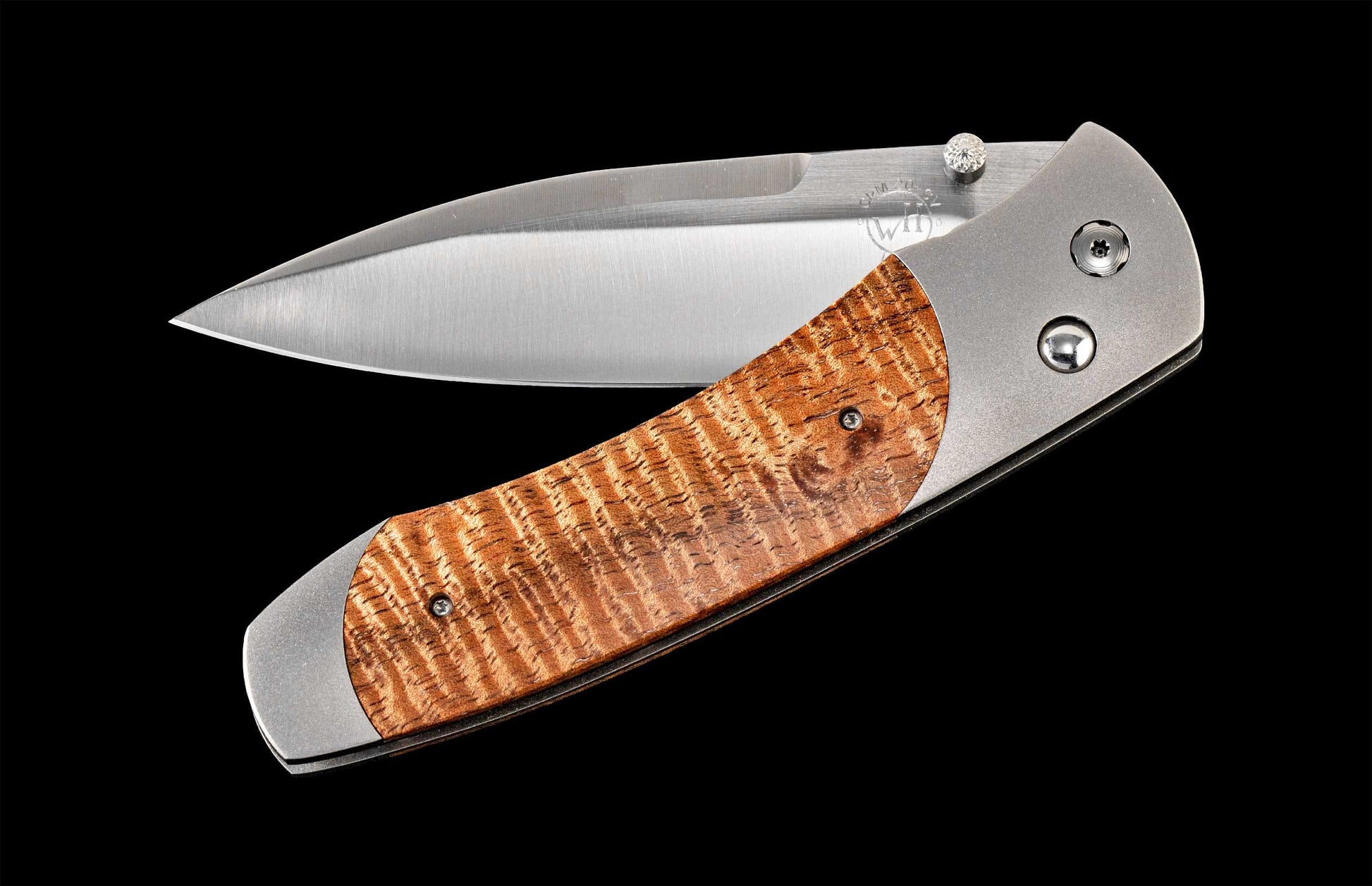 Handcrafted William Henry knife with hand-finished titanium frame, inlaid with curly koa wood and a CPM 20CV blade