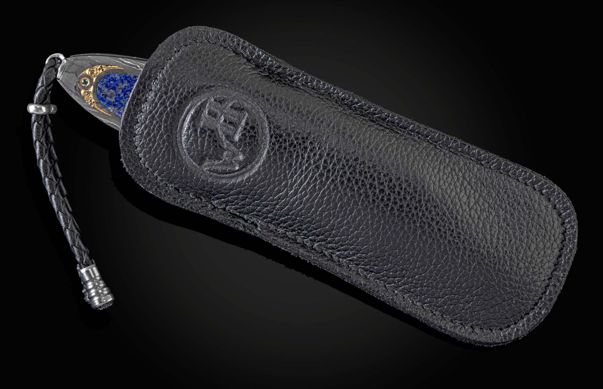Handcrafted knife from William Henry with hand-forged damascus frame by Chad Nichols