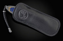 Handcrafted knife from William Henry with hand-forged damascus frame by Chad Nichols