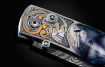 Handcrafted pocket knife from William Henry features a hand-engraved skull and intricate designs with 24K gold inlaid with fossil Woolly Mammoth tusk and set with spinel gemstones. The blade is damascus steel.