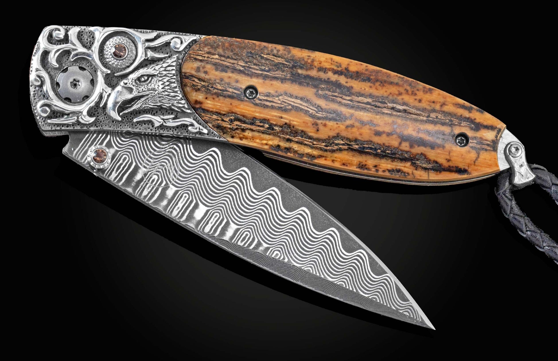 Handcrafted William Henry knife with a hand-carved sterling silver frame depicting an eagle head by Lee Downey, inlaid with Woolly Mammoth tusk, smoky quartz gemstones, and a damascus steel blade.