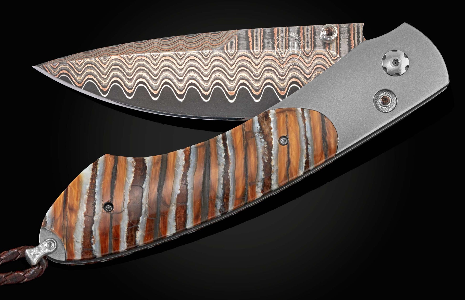 Handcrafted William Henry knife with titanium frame, inlaid with fossil Woolly Mammoth tooth, smoky quartz gems, and a hand forged Damascus steel blade.