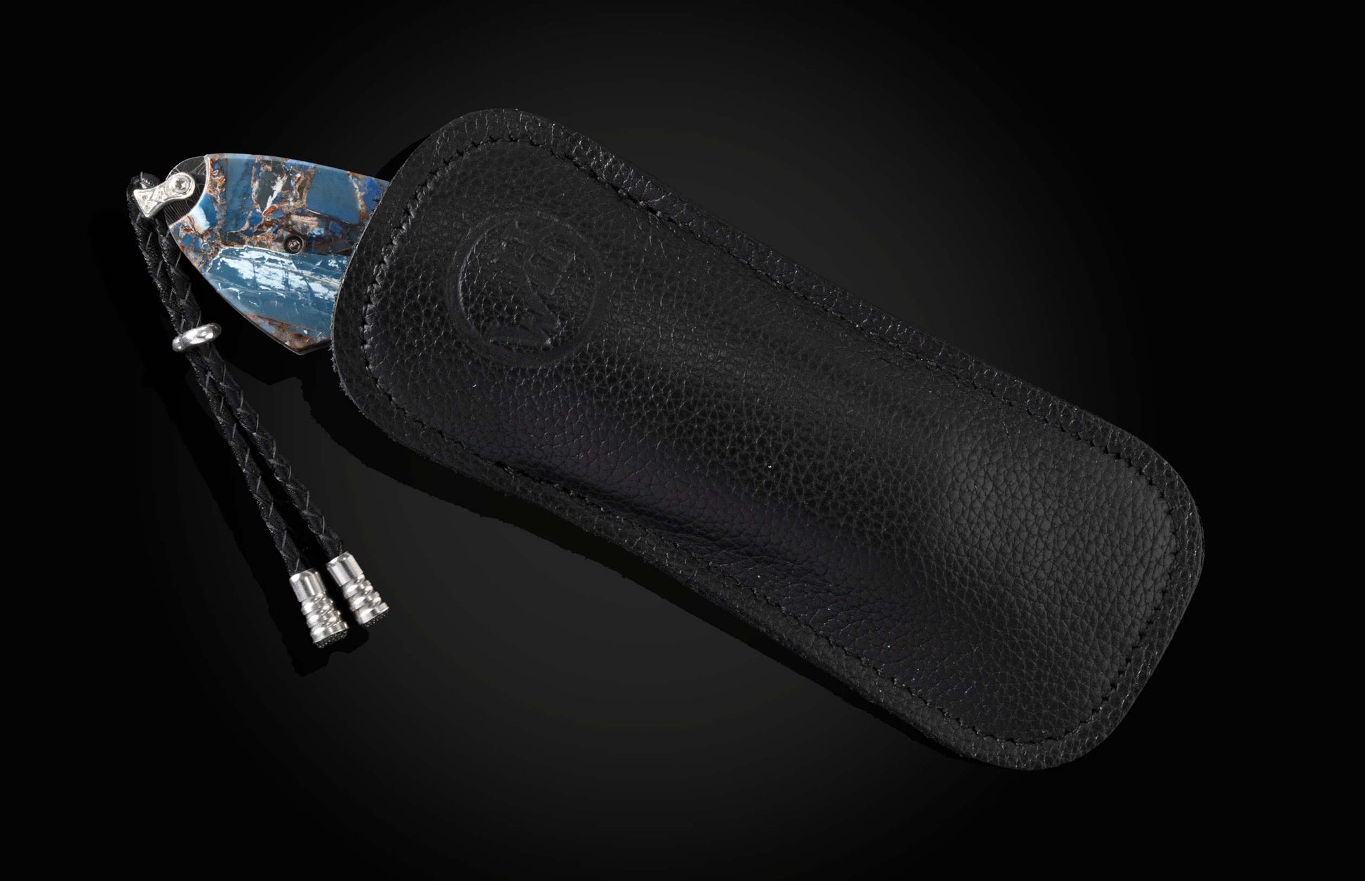 The Blue Fusion Pocketknife featuring Etched Damascus and Fossil Mammoth Tusk in a leather case