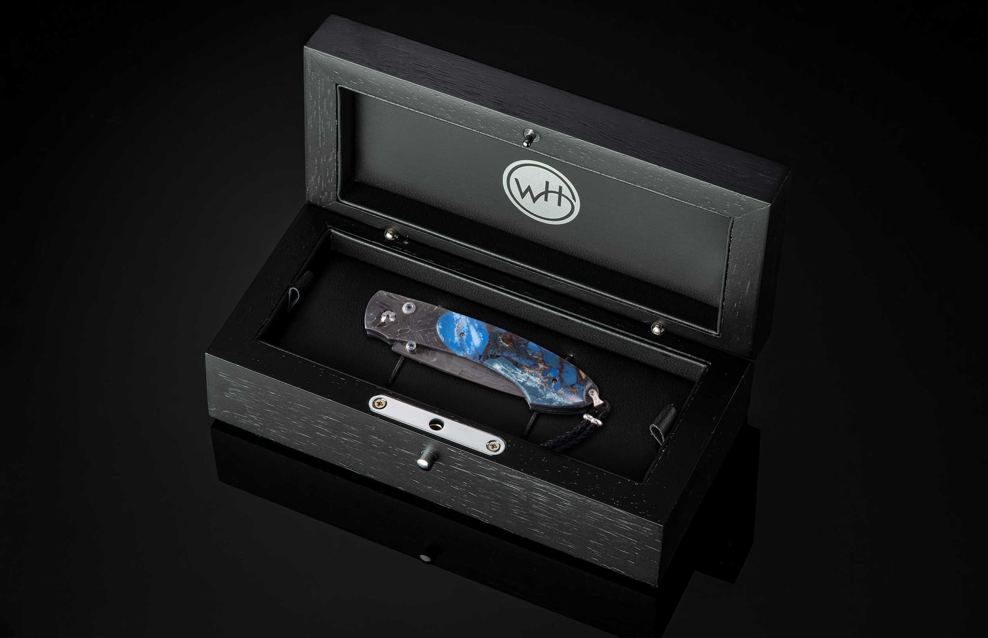 The Blue Fusion Pocketknife featuring Etched Damascus and Fossil Mammoth Tusk in a case