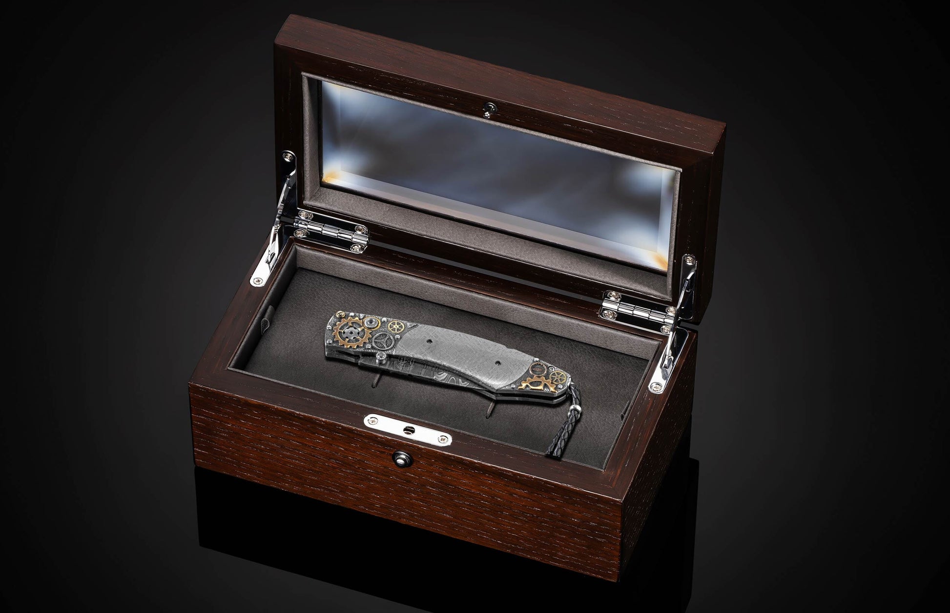 Handcrafted William Henry knife features a hand-carved sterling silver frame with watch gears by Lee Downey