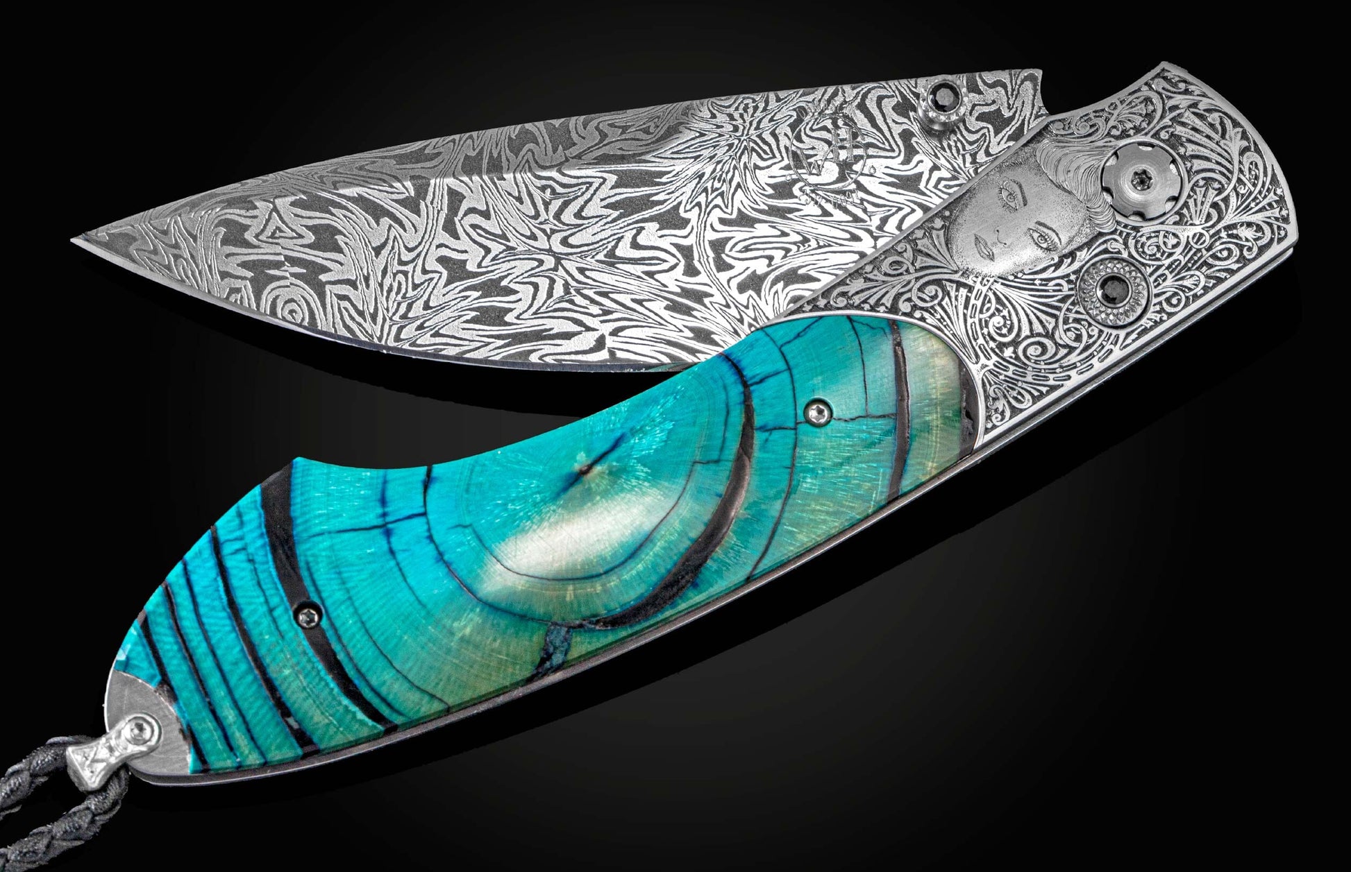 Handcrafted pocket knife from William Henry hand-engraved by Frederique Lepinois, inlaid with blue fossil Woolly Mammoth tooth,set with spinel gemstones, and a hand-forged damascus steel blade by Luke Mattern