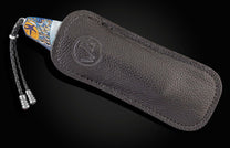 William Henry custom knife depicting sea life in an anodized hand-engraved titanium frame with 24K gold