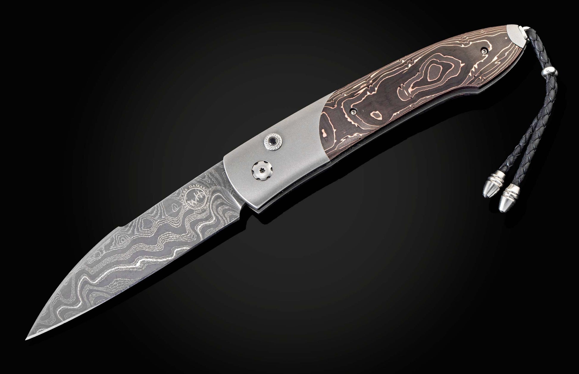 Handcrafted William Henry custom automatic knife features a titanium frame, inlaid with 'Black & Copper' scales, spinel gemstones, and a hand-forged Damascus steel blade by Chad Nichols.