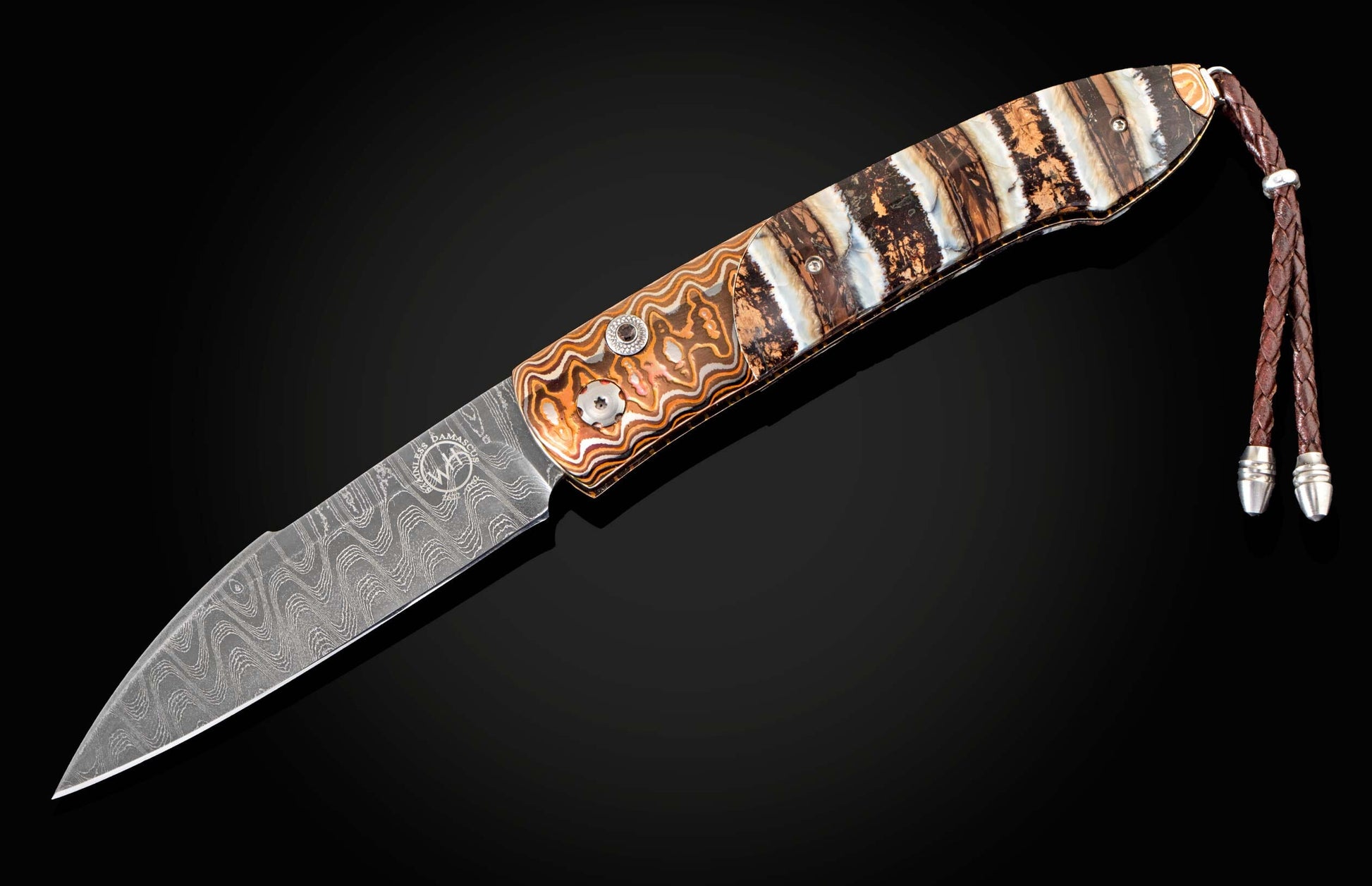 Handcrafted William Henry custom automatic knife features a heat-colored mokume frame, inlaid with fossil Woolly Mammoth tooth, smoky quartz gemstones, and a hand-forged Damascus steel blade by Chad Nichols.