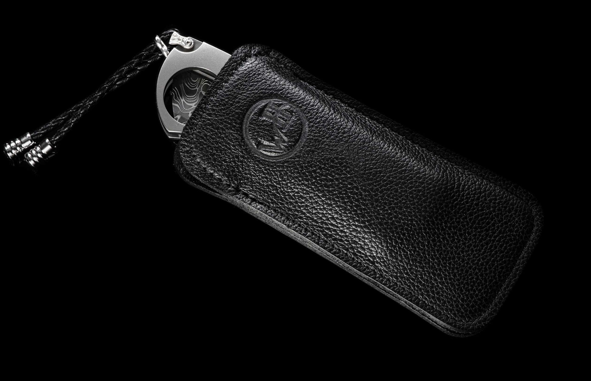 The Kingman Customized Cigar Cutter (CG1 KINGMAN) in a leather case