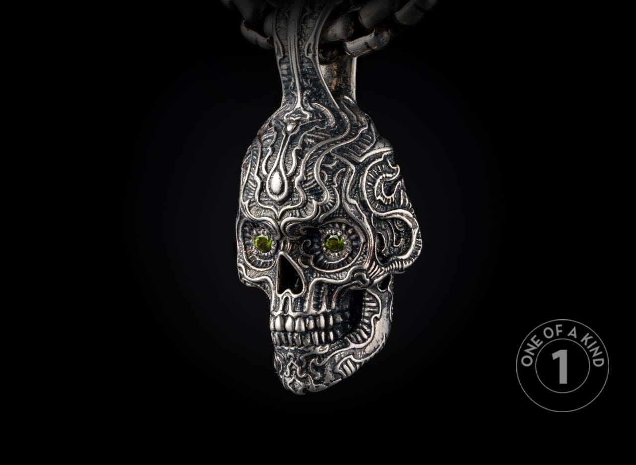 Sterling silver skull pendant necklace from William Henry with tourmaline gems.