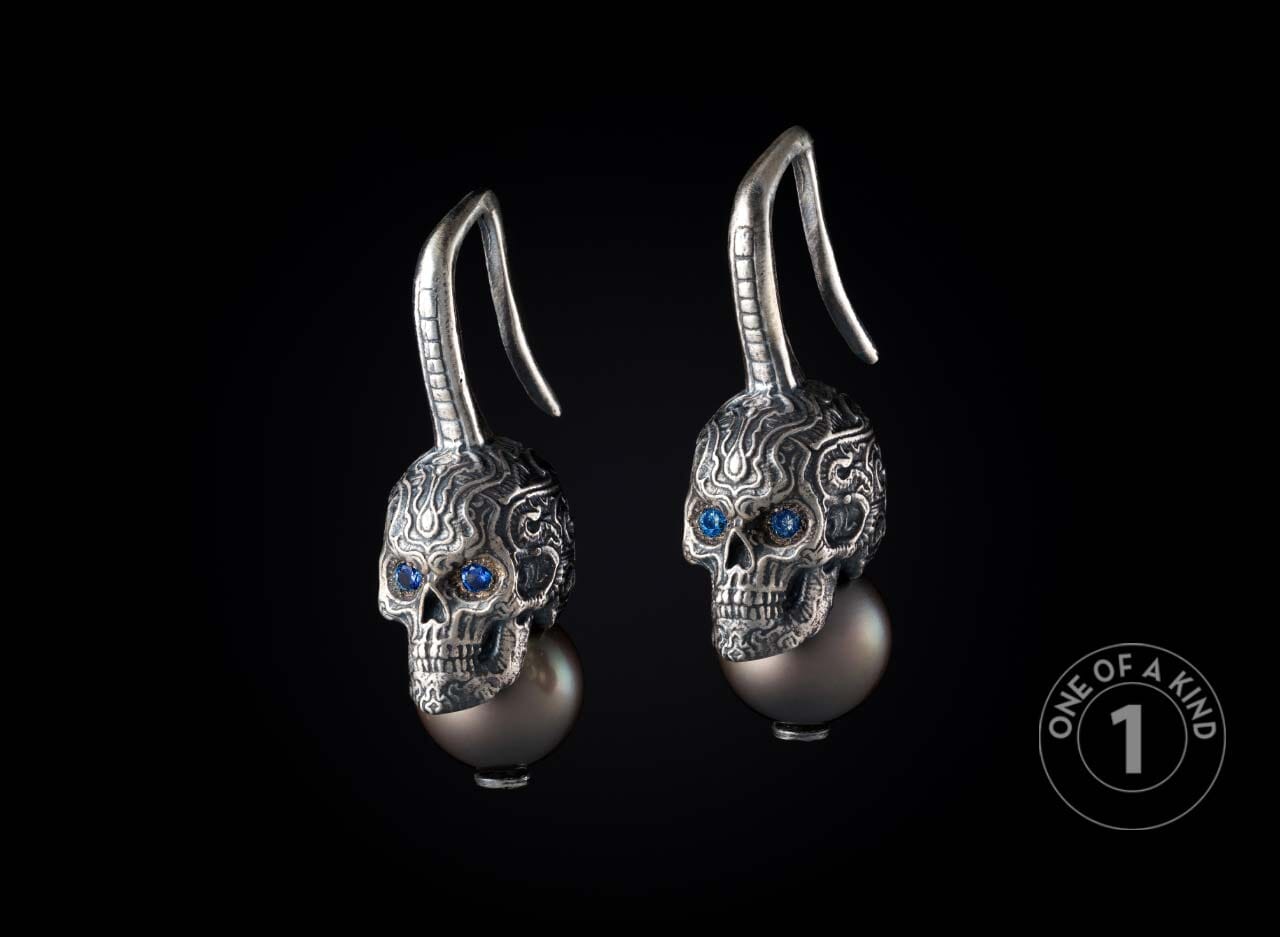 One of a kind earrings from William Henry featuring sapphires and South Sea pearls.