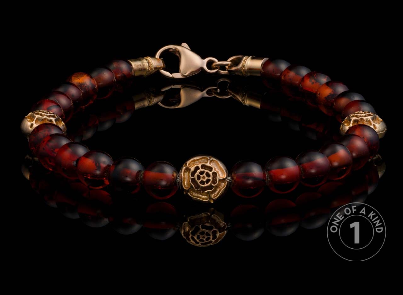 One of a Kind bracelet from William Henry featuring Cognac Amber beads and18K Rose gold beads.