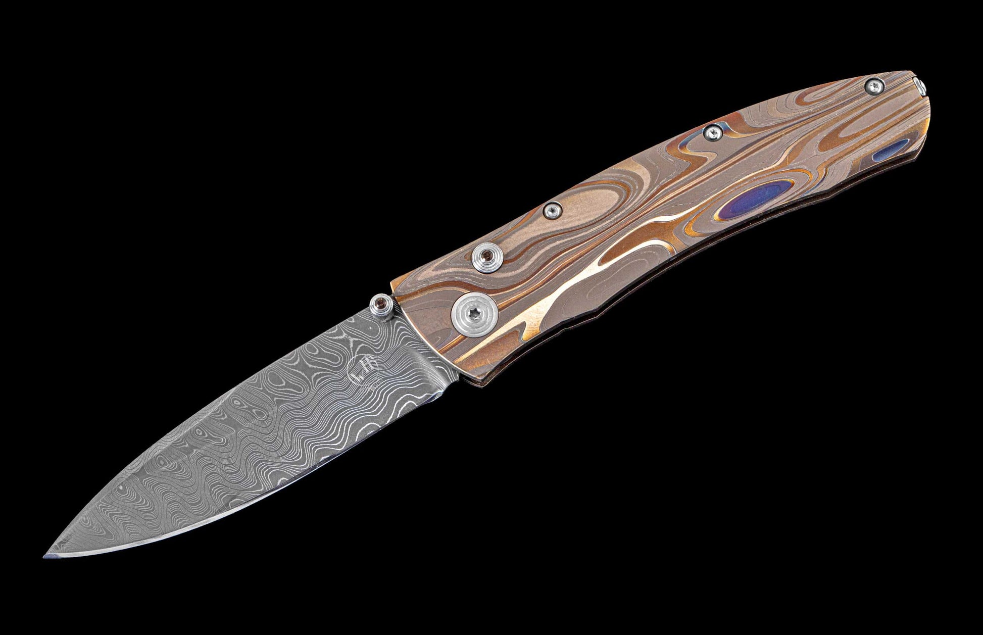 William Henry pocket knife featuring Laser color-engraved titanium frame and hand forged damascus steel blade