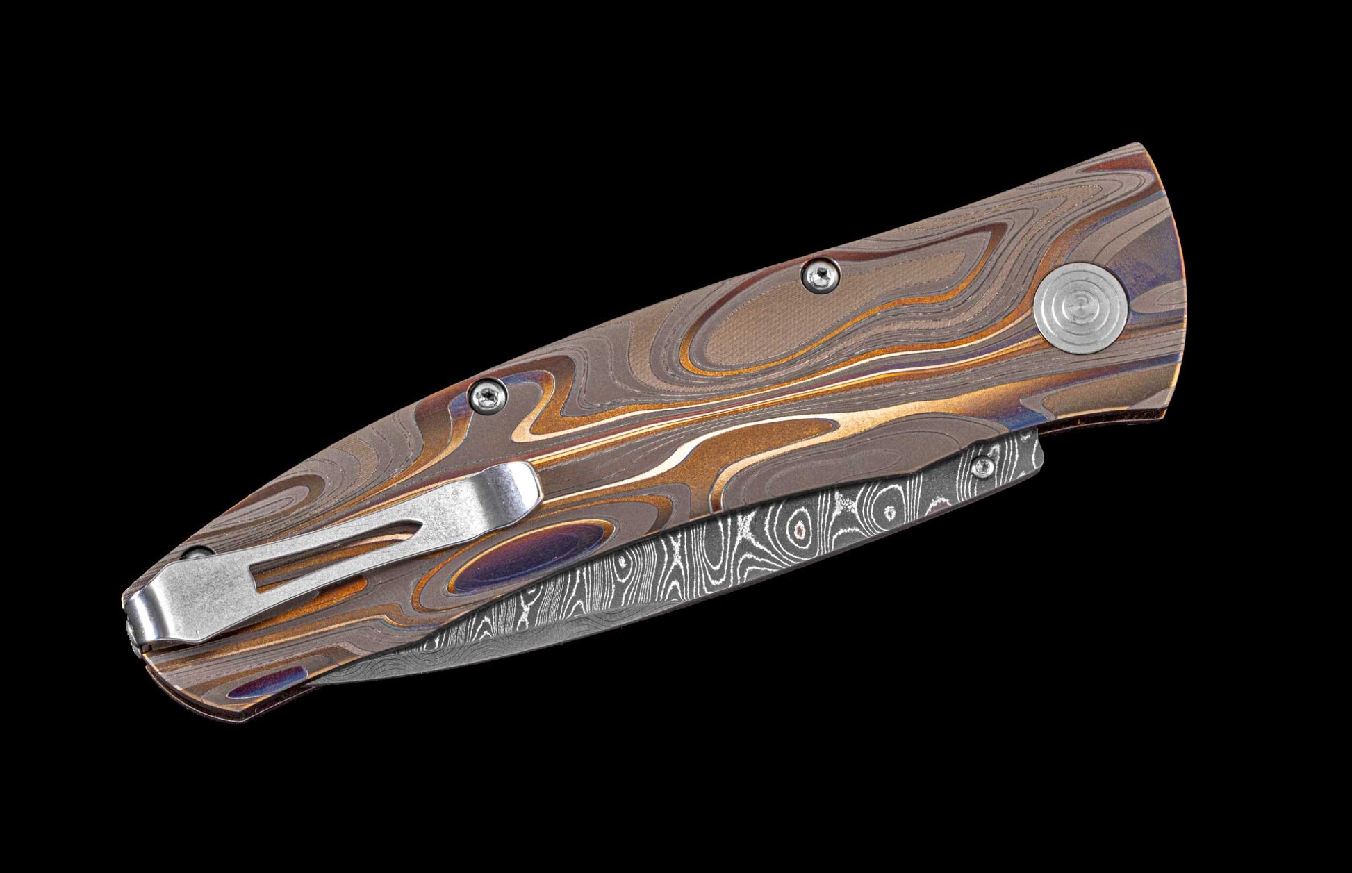 William Henry pocket knife featuring Laser color-engraved titanium frame and hand forged damascus steel blade