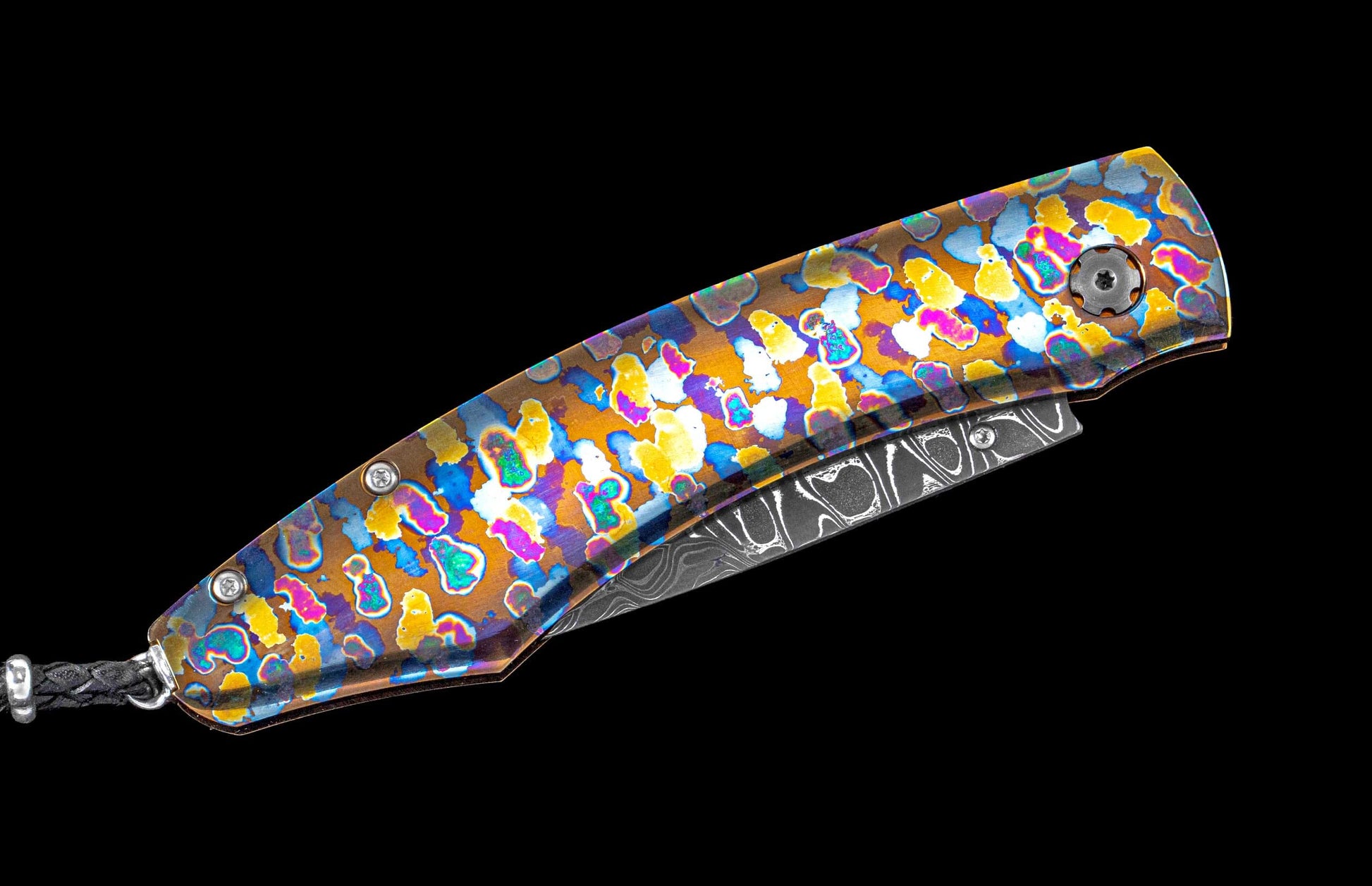 Brightly colored one of a kind William Henry knife featuring a laser colored titanium frame and hand forged damascus steel blade