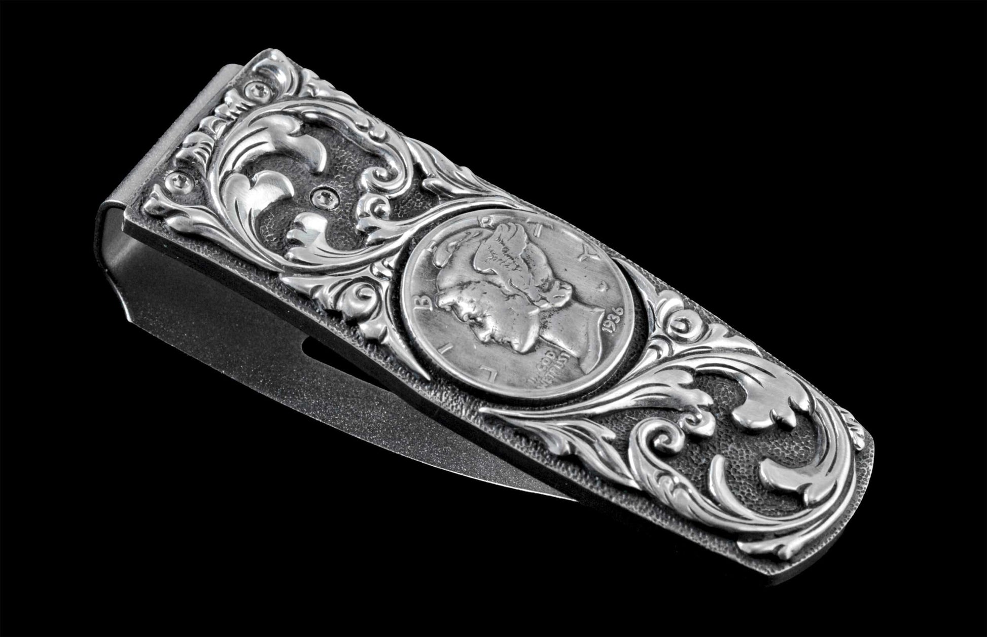 Handcrafted money clip from William Henry is hand-carved sterling silver by Lee Downey, and inlaid with a Mercury dime.