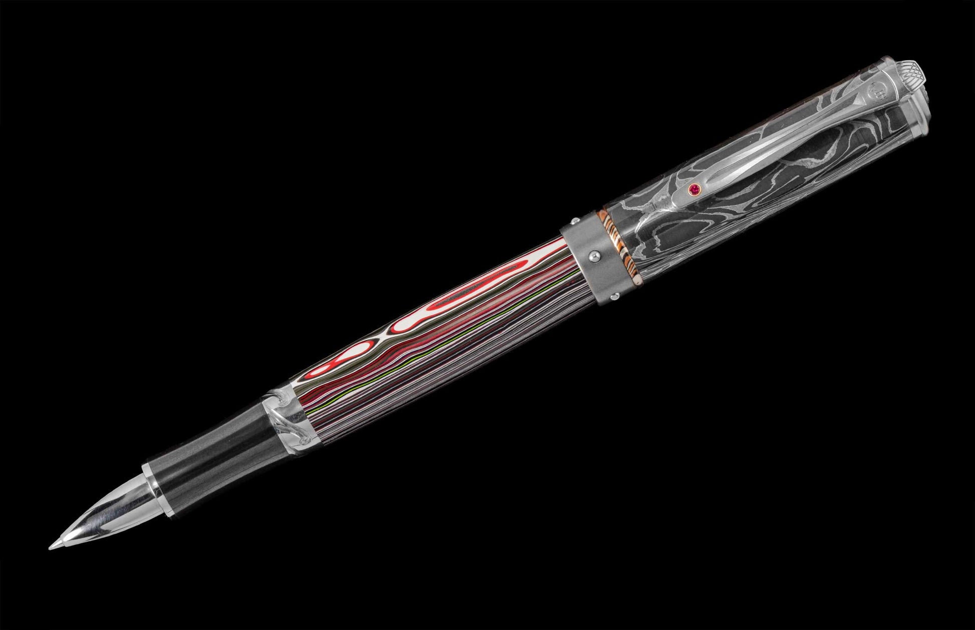  the pocket clip is set with a ruby gemstone.