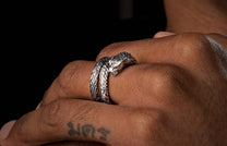 A Sculpted Sterling Silver Snake Ring on a finger